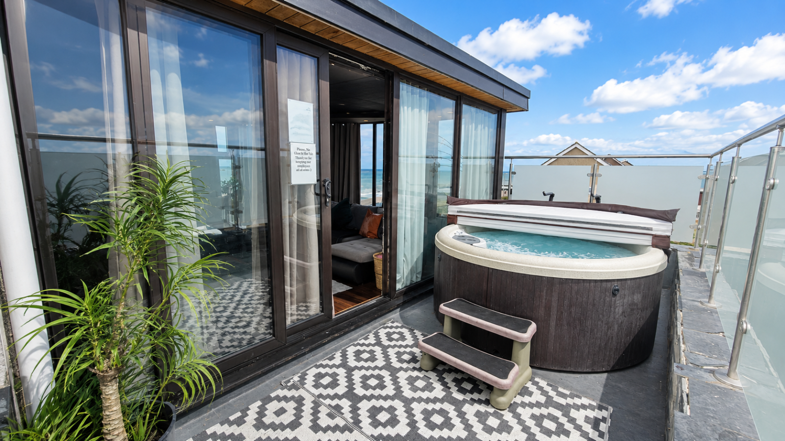 Rooftop private hot tub at The Hub with sea views